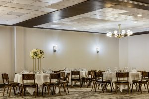 Grand ballroom banquet setup with round tables and chairs at Nashville event venue Hotel Preston Nashville Airport